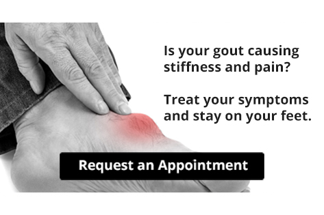 Person holding painful red inflamed foot from gout